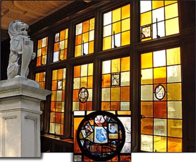 Antique amber and gold leaded stained glass inside the Charles S. Pillsbury Mansion, the kind of interior Mary grew up surrounded by