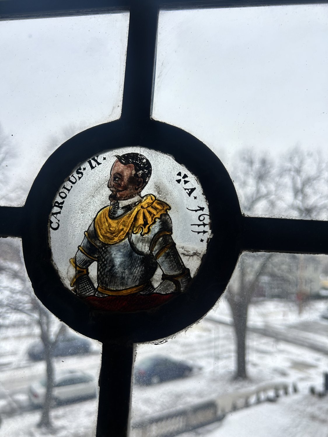 Figural stained glass roundel