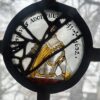 A seventeenth-century painted glass roundel in a Pillsbury Mansion window showing a standing figure in silver armour with a gold sash, lettered GUSTAVUS ADOLPHUS with the years 1611 and 1632.