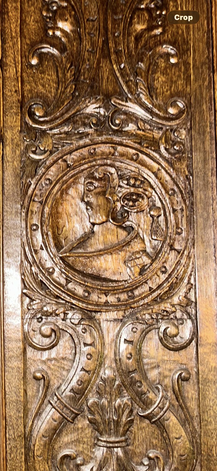 Carved Tudor rose and court birds